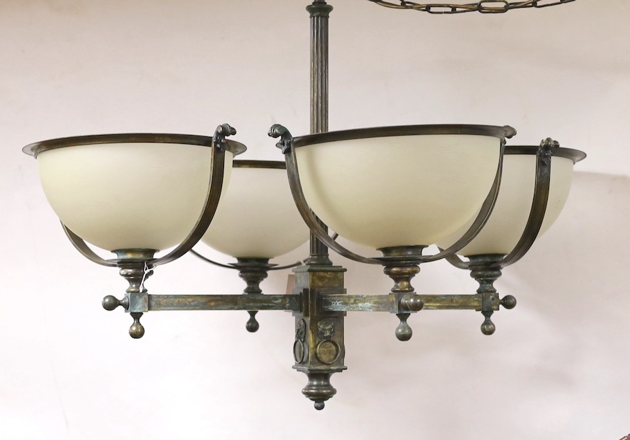 A brass 4 branch ceiling light with opaque glass shades, 72 cms high x 94 cms wide.